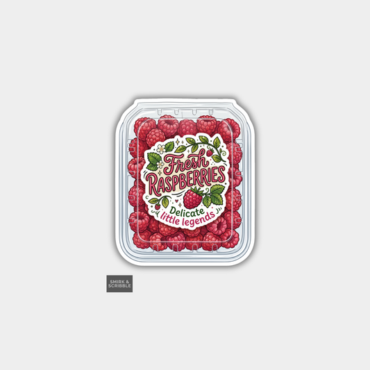 Packaging of fresh raspberries with decorative label on a light gray background